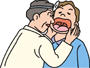 口内をチェックしている歯科医の男性の画像