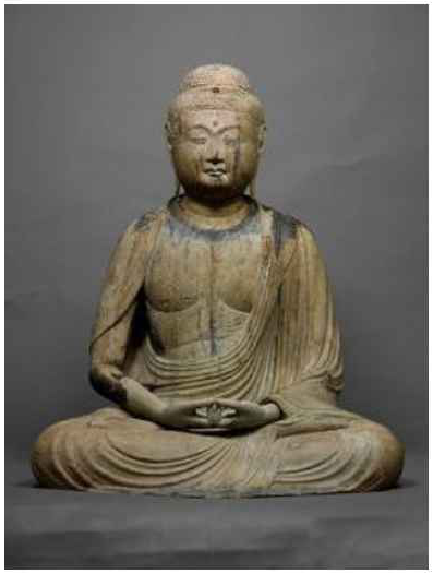 Seated wooden statue